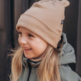 Cepure ar austiņām un šalli